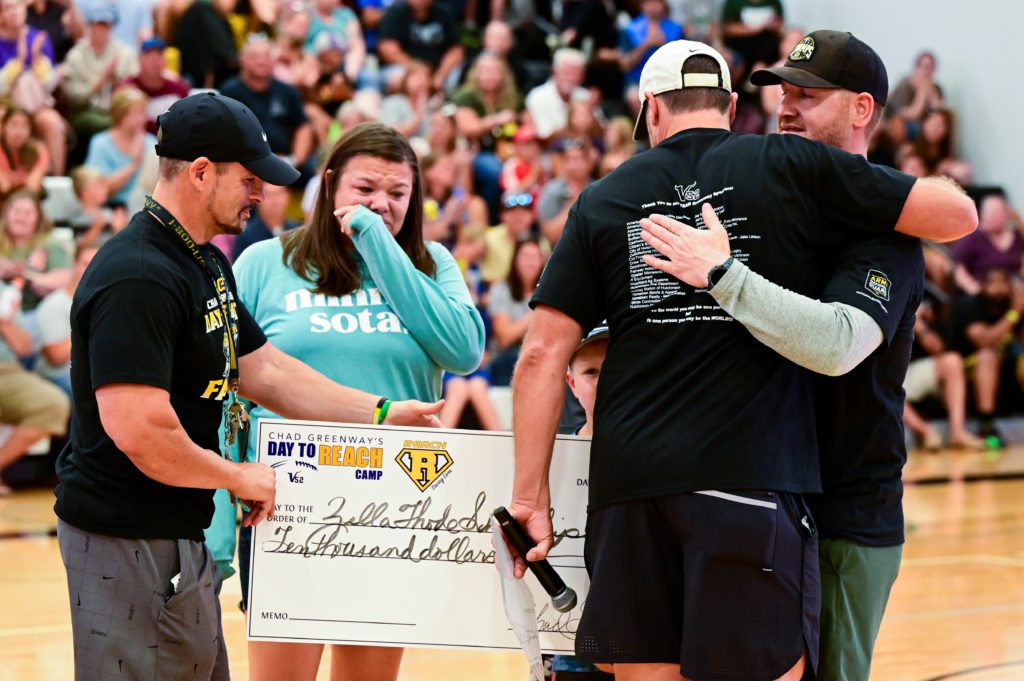 Family receiving check from Chad Greenway