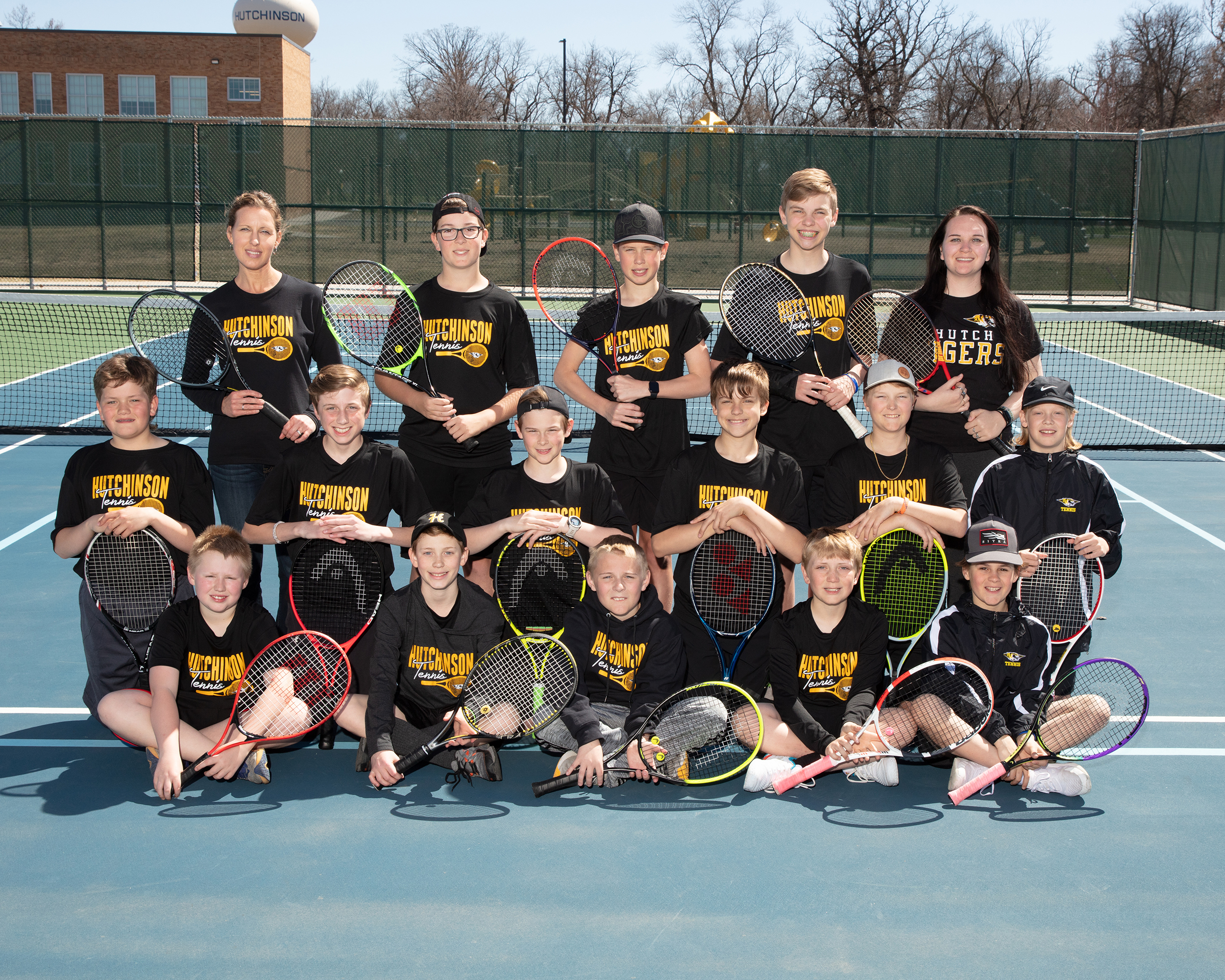 group photo of middle school boys tennis team