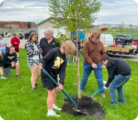 students planting trees